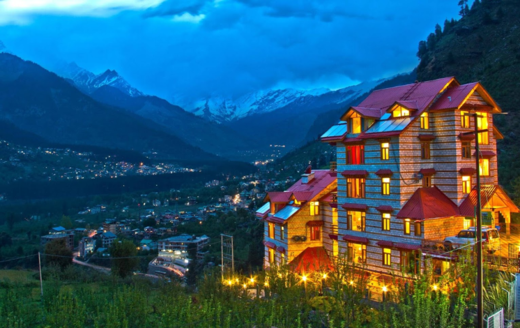 Resort with view of Manali town and the backdrop of Himalayas